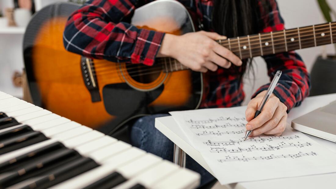 https://www.freepik.com/free-photo/close-up-hand-writing-song_12418534.htm#query=music%20school&position=5&from_view=search&track=aisPicture