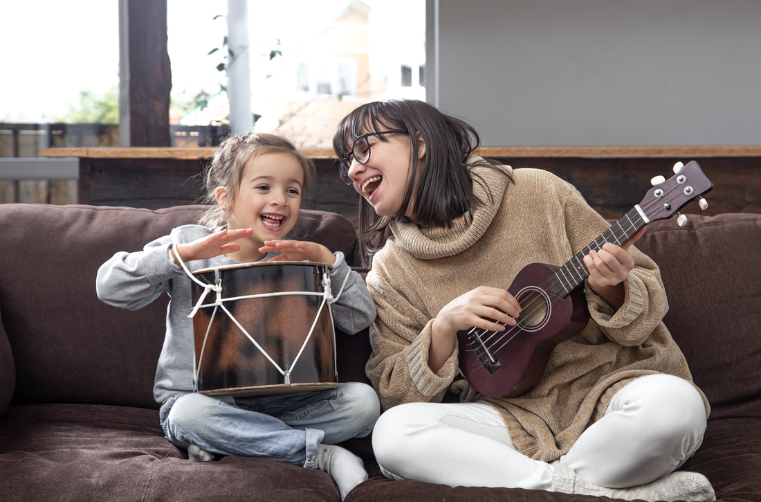Picturehttps://www.freepik.com/free-photo/mom-plays-with-her-daughter-home-lessons-musical-instrument-children-s-development-family-values-concept-children-s-friendship-family_12339201.htm#query=playing%20instrument%20smile&position=34&from_view=search&track=ais