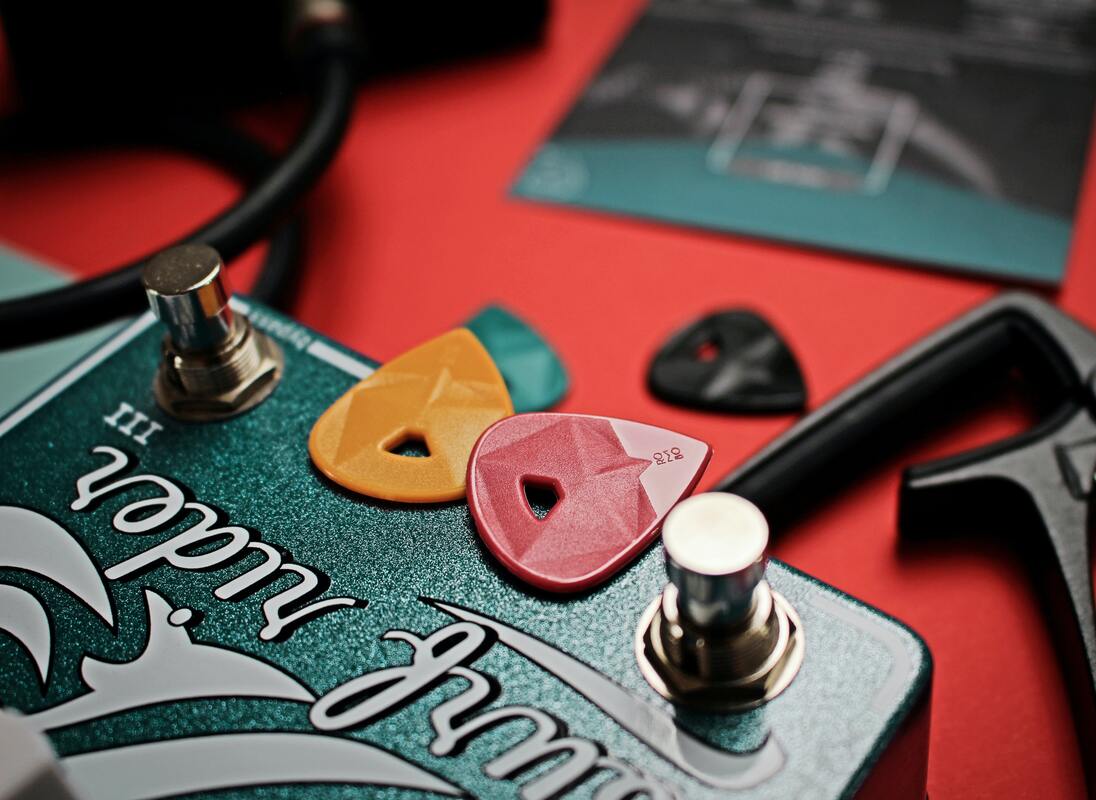 Picturehttps://www.pexels.com/photo/two-guitar-picks-on-guitar-pedal-2912980/