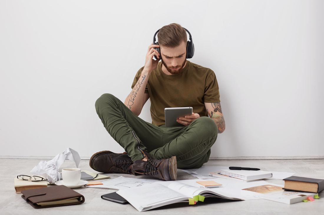 https://www.freepik.com/free-photo/young-stylish-male-listens-music-with-headphones-holds-modern-tablet-computer-communicates-with-friends-relatives-online_9879953.htm#fromView=search&page=1&position=5&uuid=9b9ac0b3-880c-49bb-9abf-741474786858Picture